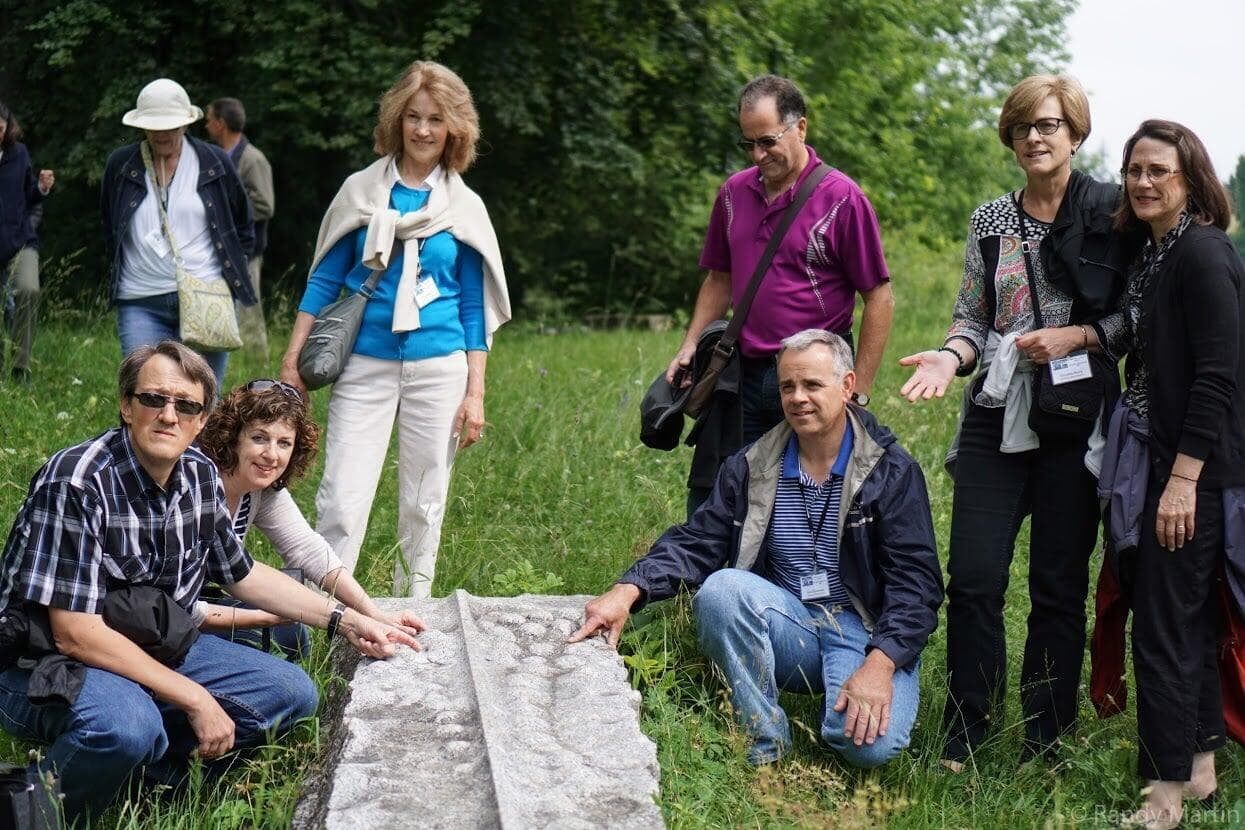 A TourMagination Heritage Tour group visiting the Schleitheim monument in Switzerland.