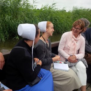 Two school teachers talking with Dutch host