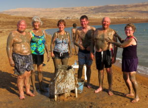 Marvin and Violet Miller, Susan and Ray Martin, Larry and Elaine Short model the Dead Sea mud treatment that is fashionable in these parts.