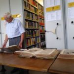 Gary showing us an early German Bible in the archive.